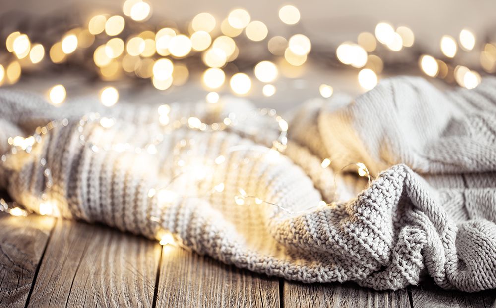 cozy-winter-composition-with-knitted-element-and-blurred-background-with-bokeh.jpg